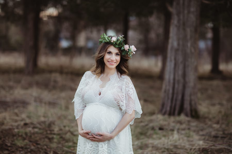 maternity session in white gown and crown