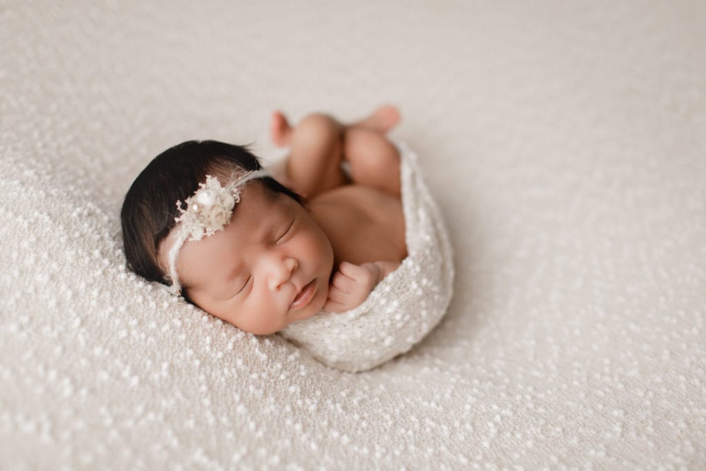 newborn baby girl in white 