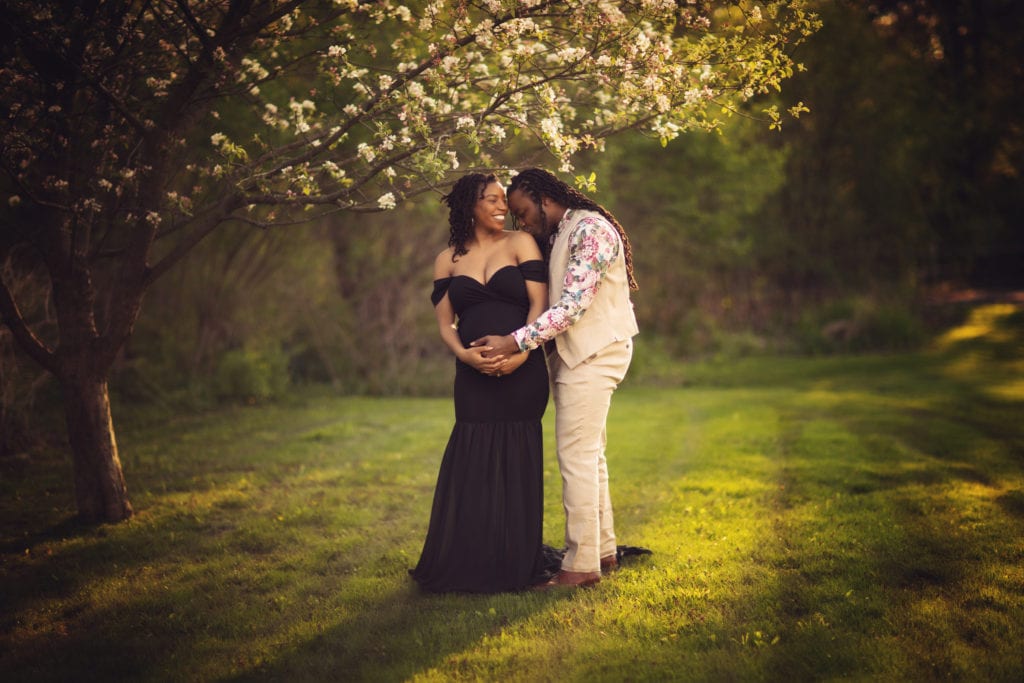 gorgeous couple in spring outdoor maternity professional photo shoot 