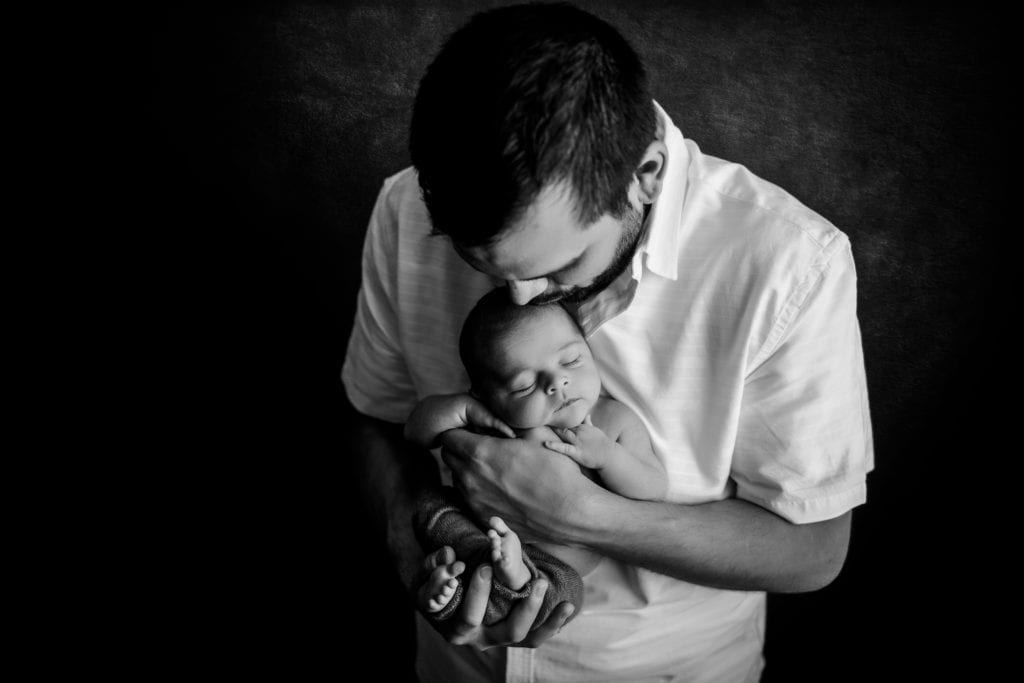 black and white dad with newborn son