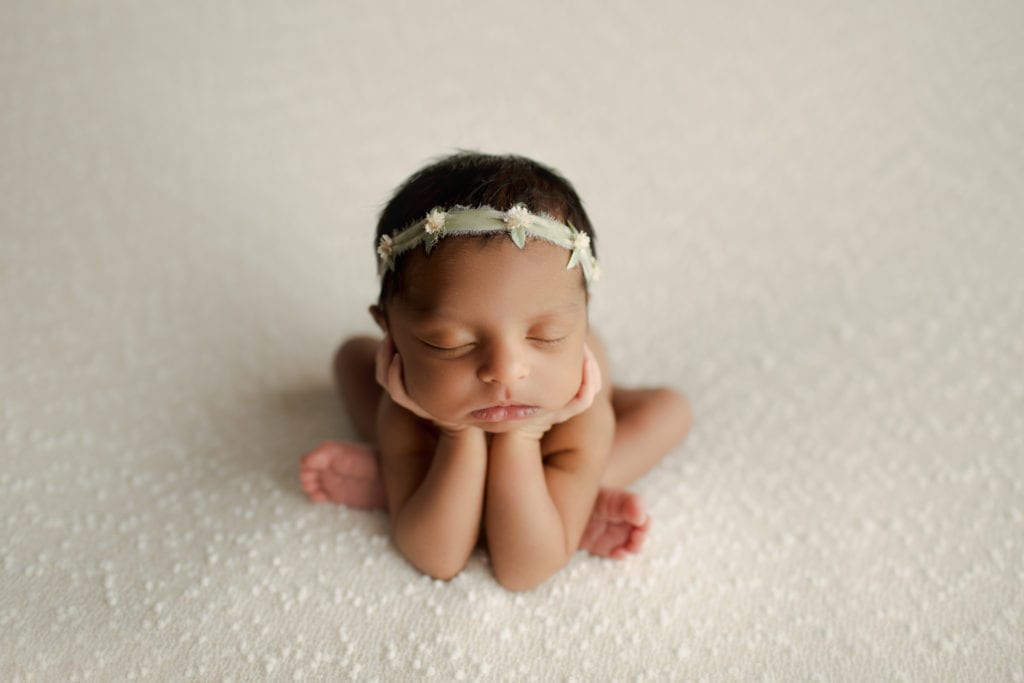 newborn girl in froggy pose