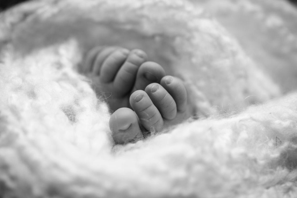 black and white newborn feet