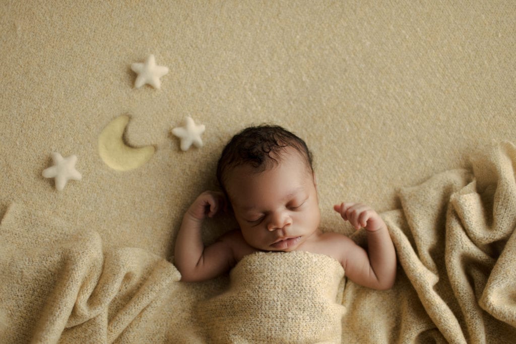 baby with moon and stars