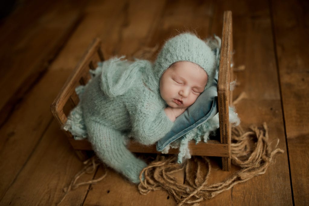 newborn baby boy in photo shoot