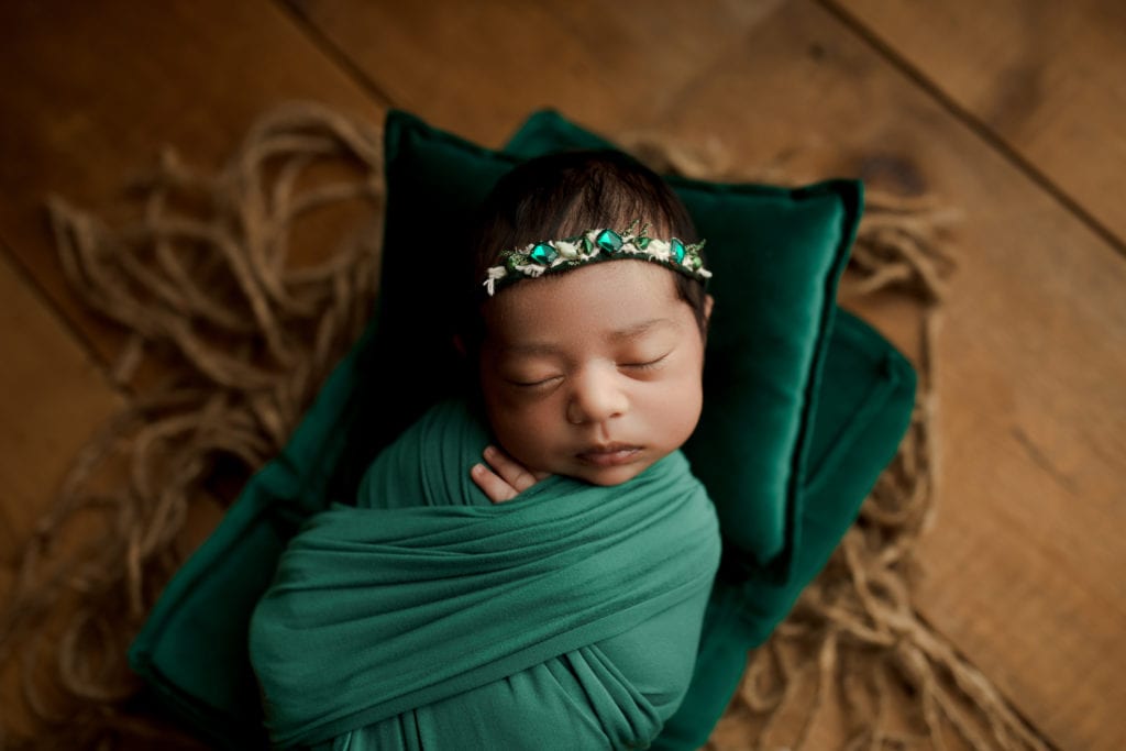 baby girl in green