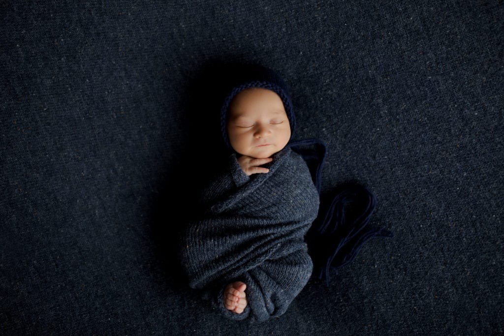 newborn baby boy wrapped in Long Grove studio