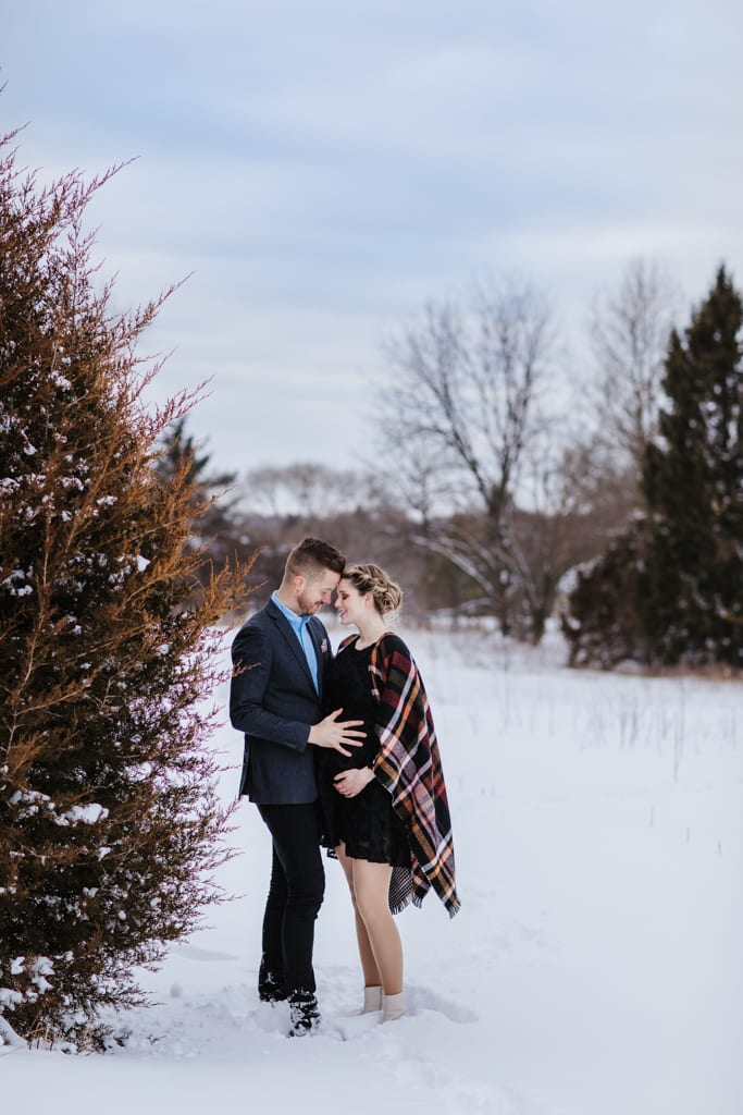Couple in snow, Chicago winter maternity photo shoot