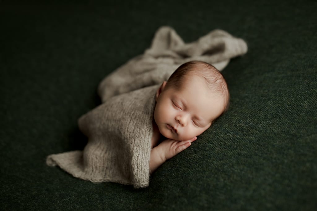 infant boy sleeping on beanbag, professional newborn portraits Illinois