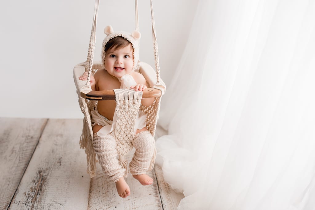 baby in swing with bear cap, Palatine baby photography
