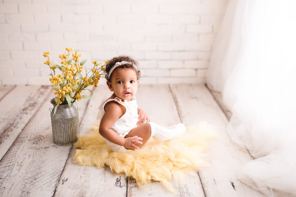 baby portraits, baby girl with bouquet of yellow flowers