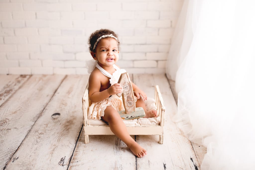 Chicagoland baby photographer, toddler girl holding wooden number one