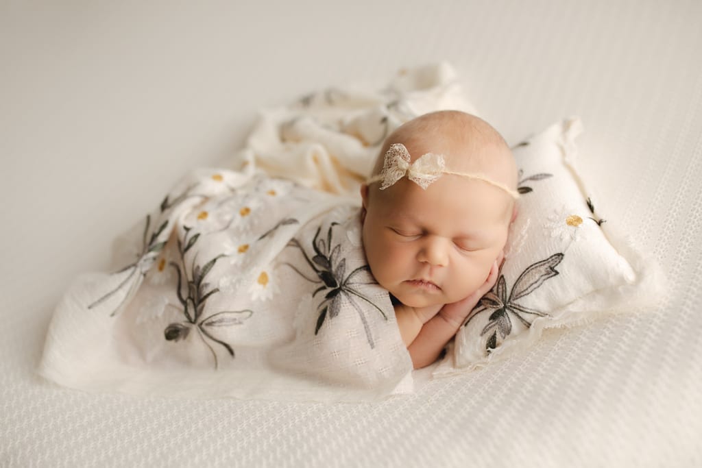Chicago newborn photographer, baby girl with daisy blanket and pillow
