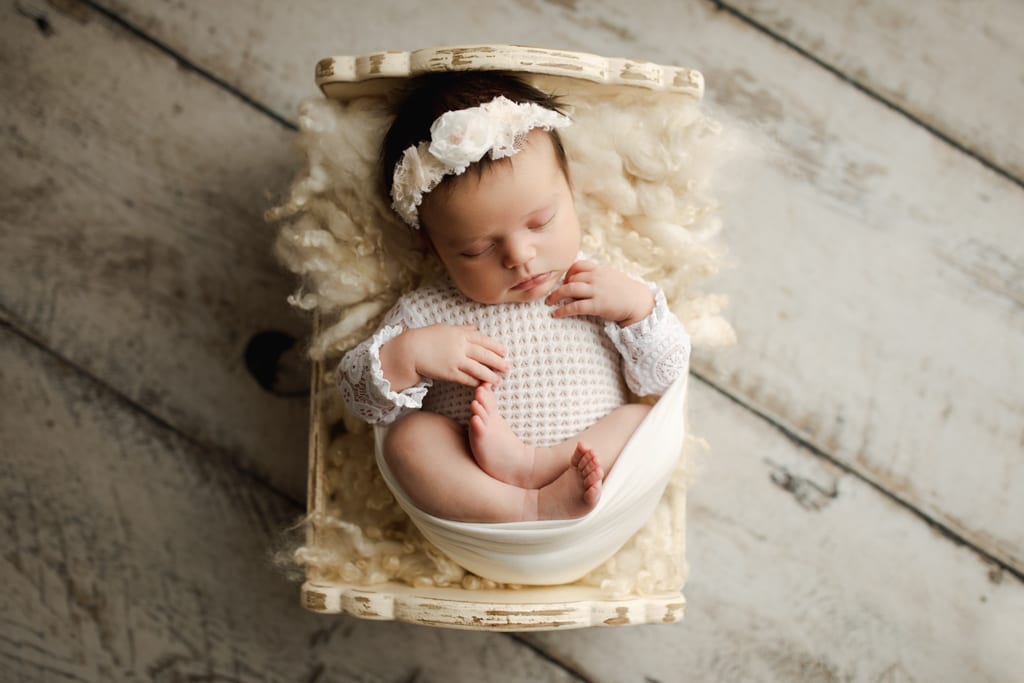infant asleep on mini bed, best palatine newborn photographers