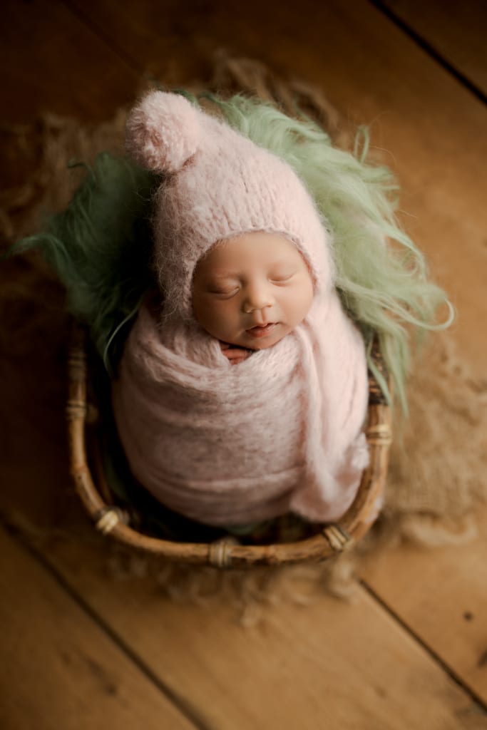 swaddled baby sleeping in basket, baby pictures near Arlington Heights