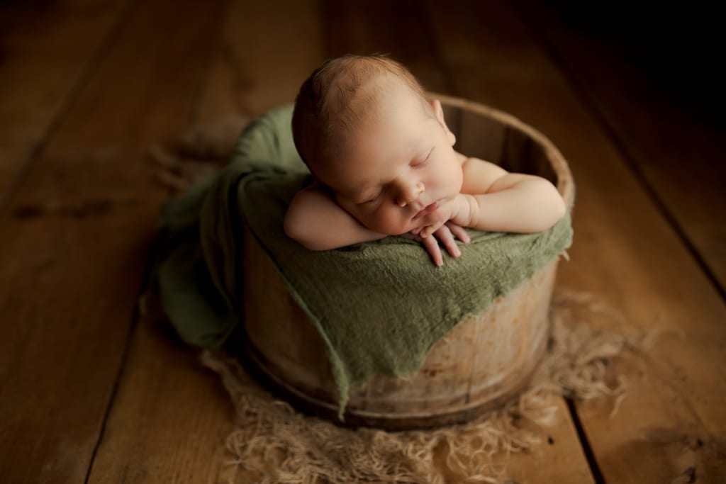 Chicago newborn photos, baby boy asleep in bucket