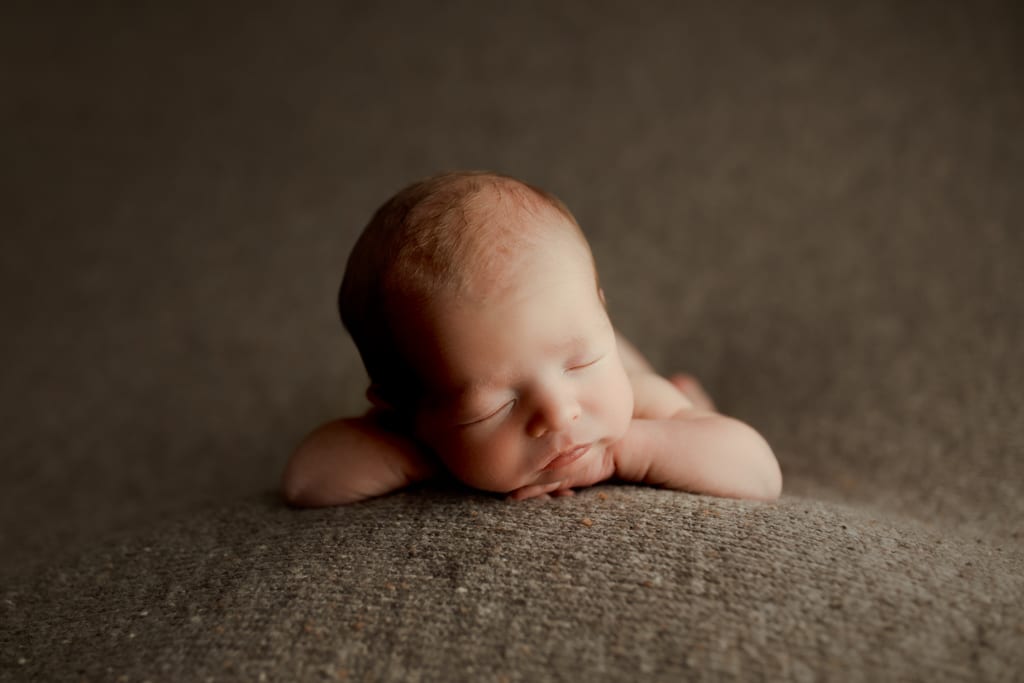 newborn photography near me Chicago, baby boy asleep with chin on hands