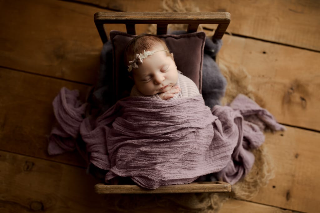 newborn photo studio Illinois, baby girl asleep on mini bed