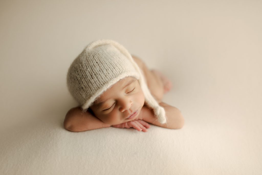 Palatine newborn pictures, baby boy asleep with soft nightcap