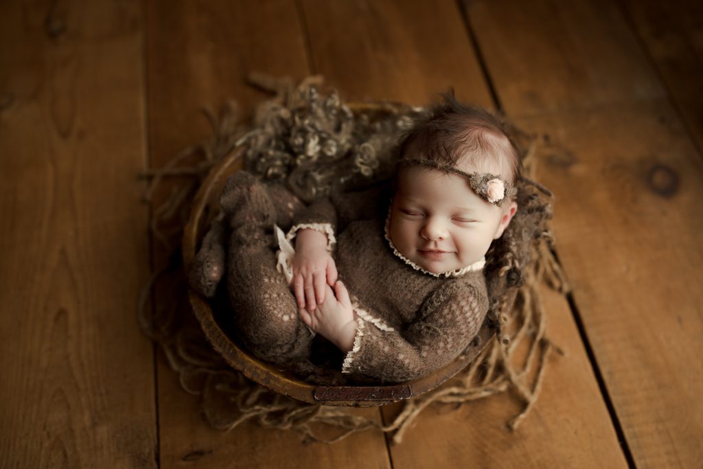Long Grove Illinois newborn photographer, baby girl asleep in wooden bowl