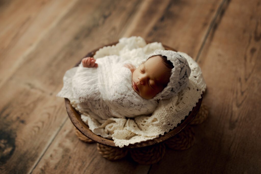 newborn girl in white lace