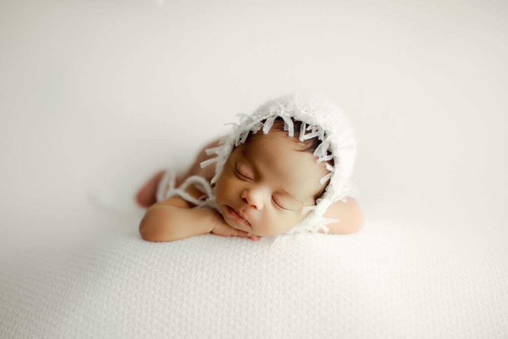Baby girl in white cap