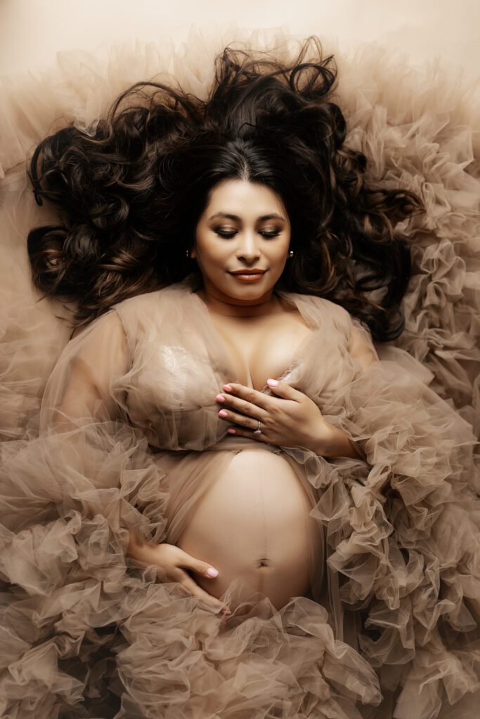 Woman in sheer maternity gown 