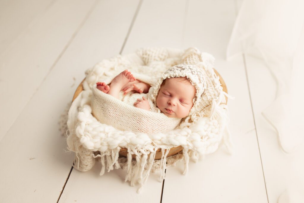 Sleeping infant posed by Lake County newborn photographer Agata Brannon