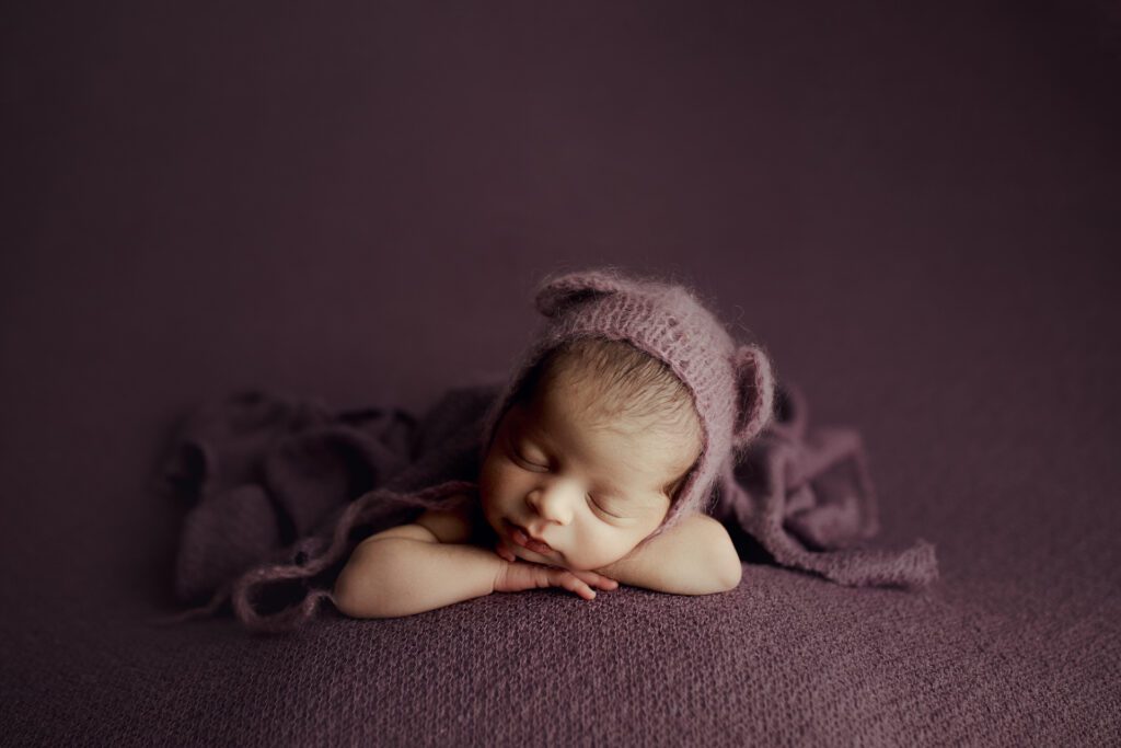 Baby girl asleep in photo studio