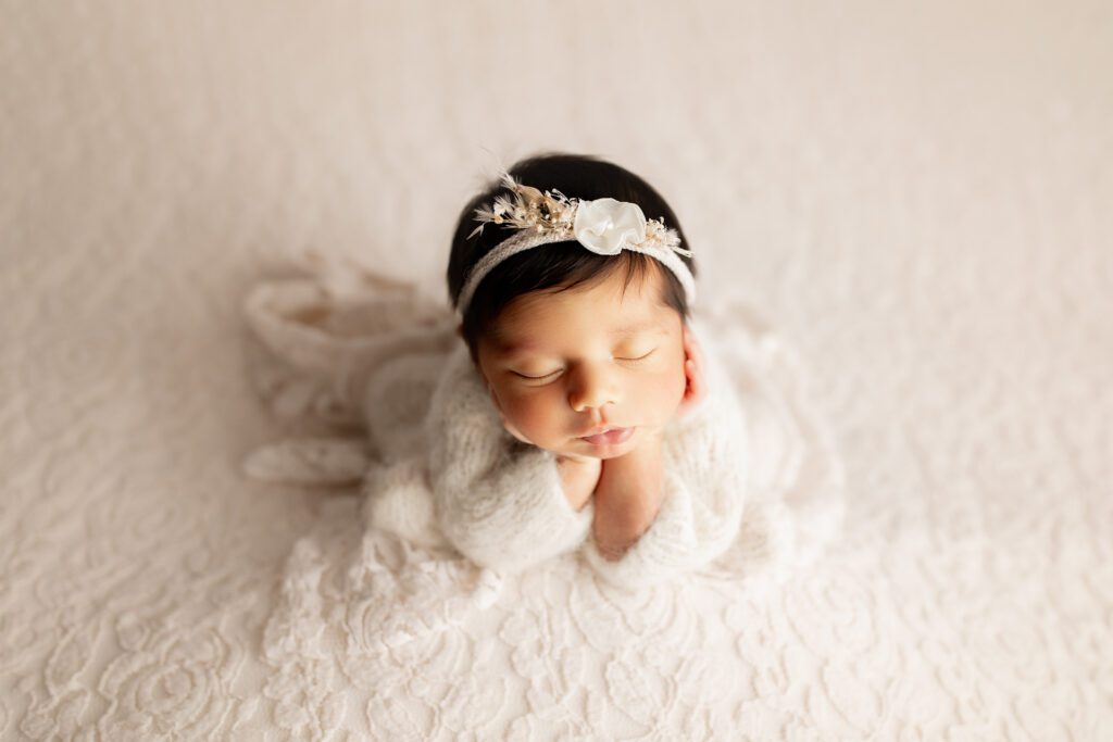 Baby girl dressed in white for photoshoot near North Chicago suburbs