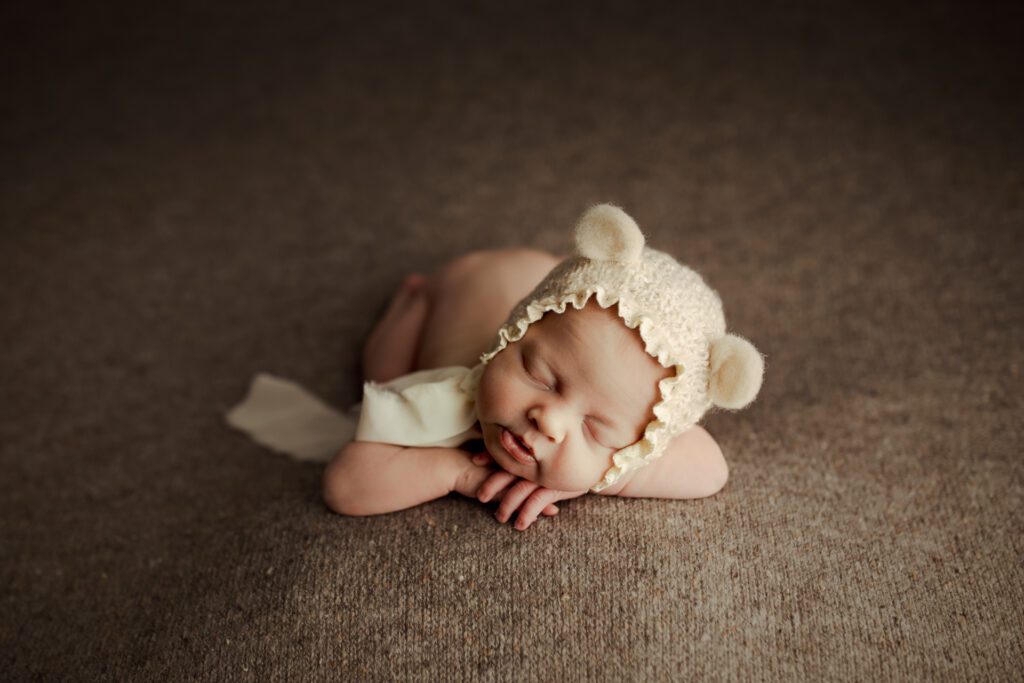 Infant in bear cap in photo studio near Schaumburg Illinois