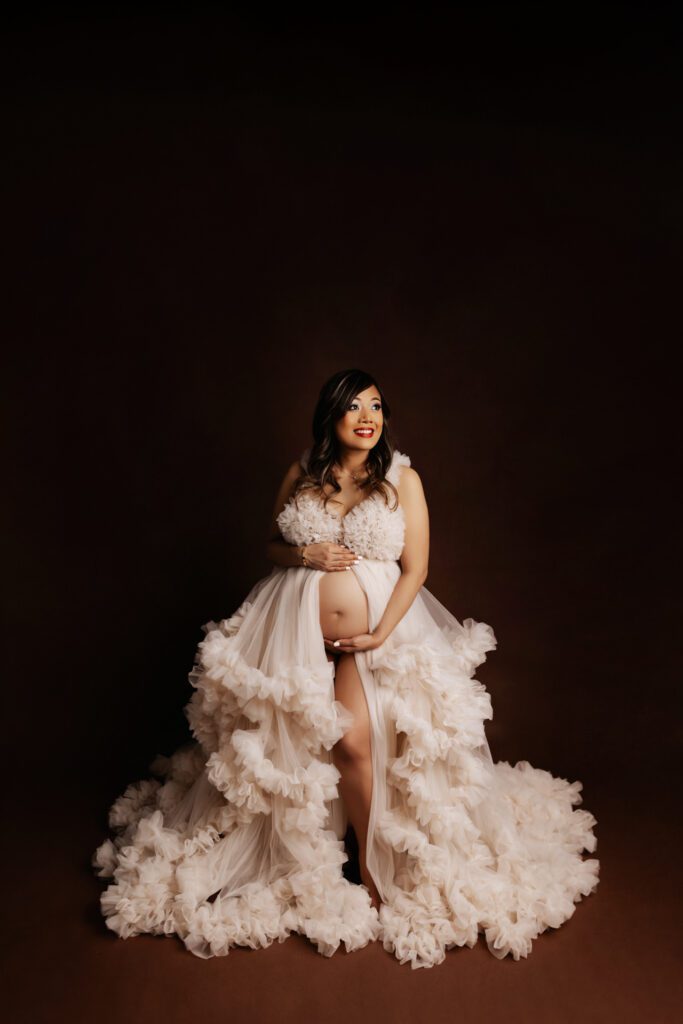 Woman in white tulle maternity gown