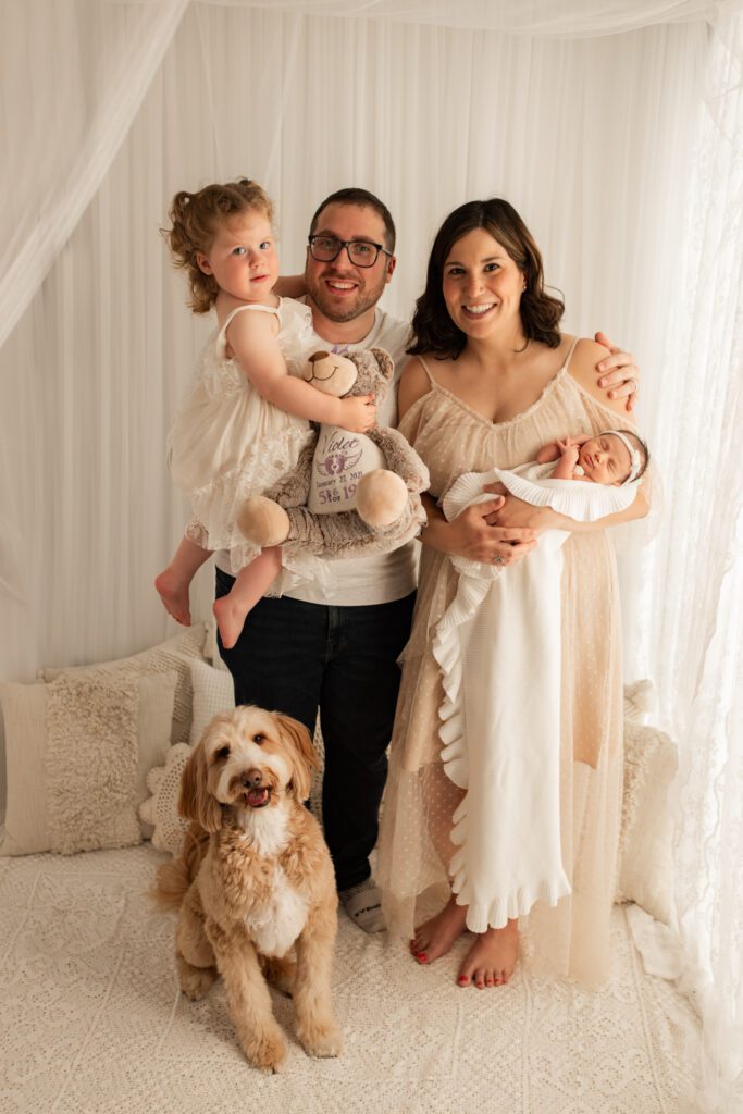 Beautiful baby pictures with dog and family in northwest Chicago studio