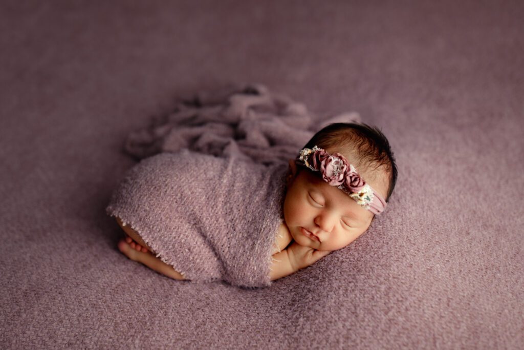 Baby girl asleep in Chicagoland newborn studio