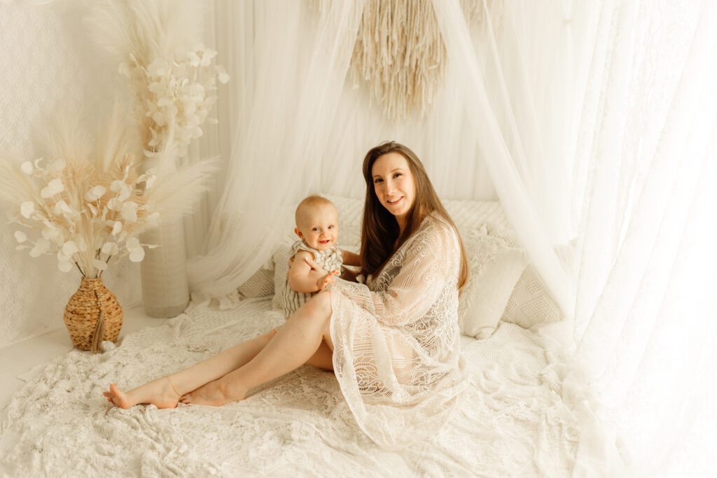 Mom relaxes with baby in an elegant lifestyle setup in Chicago portrait studio